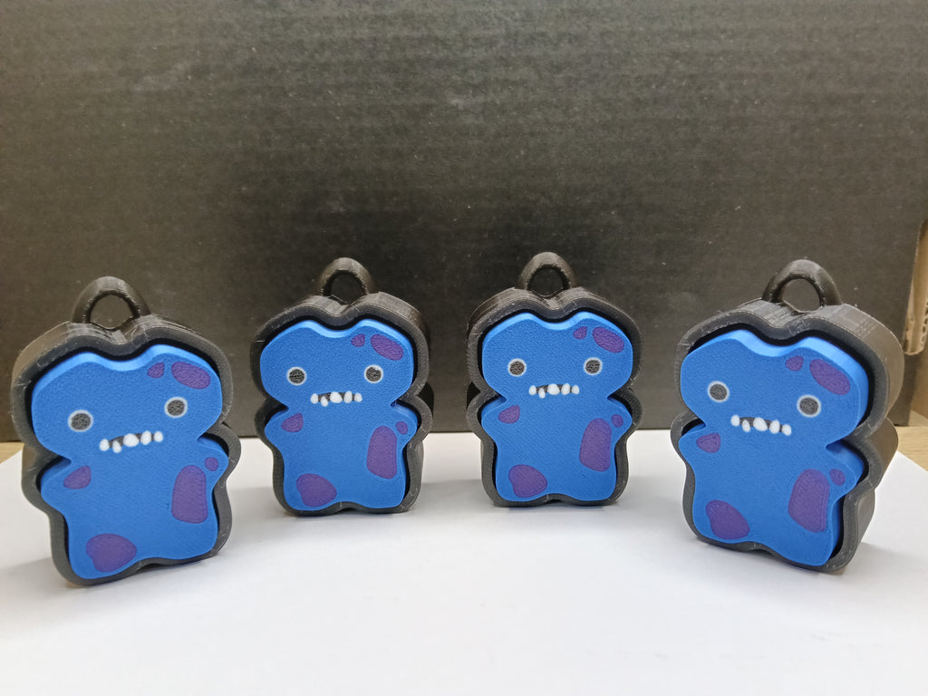 Fuggler Clicker – Niebieski potworek z fioletowymi plamkami | Antystresowy brelok