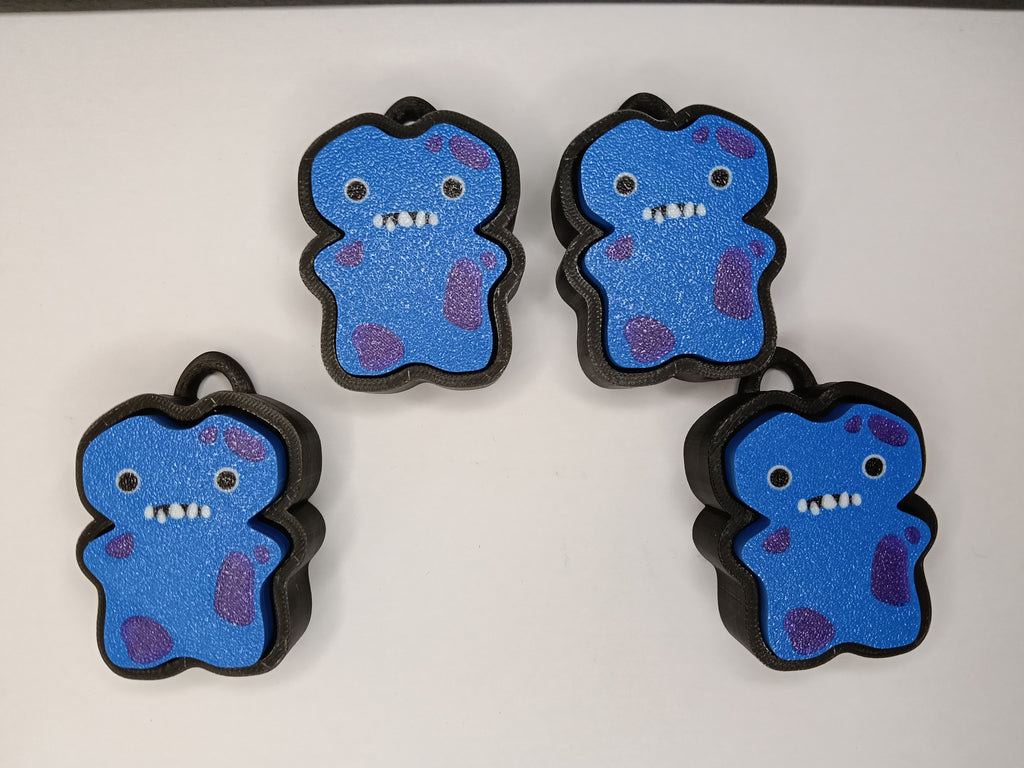 Fuggler Clicker – Niebieski potworek z fioletowymi plamkami | Antystresowy brelok