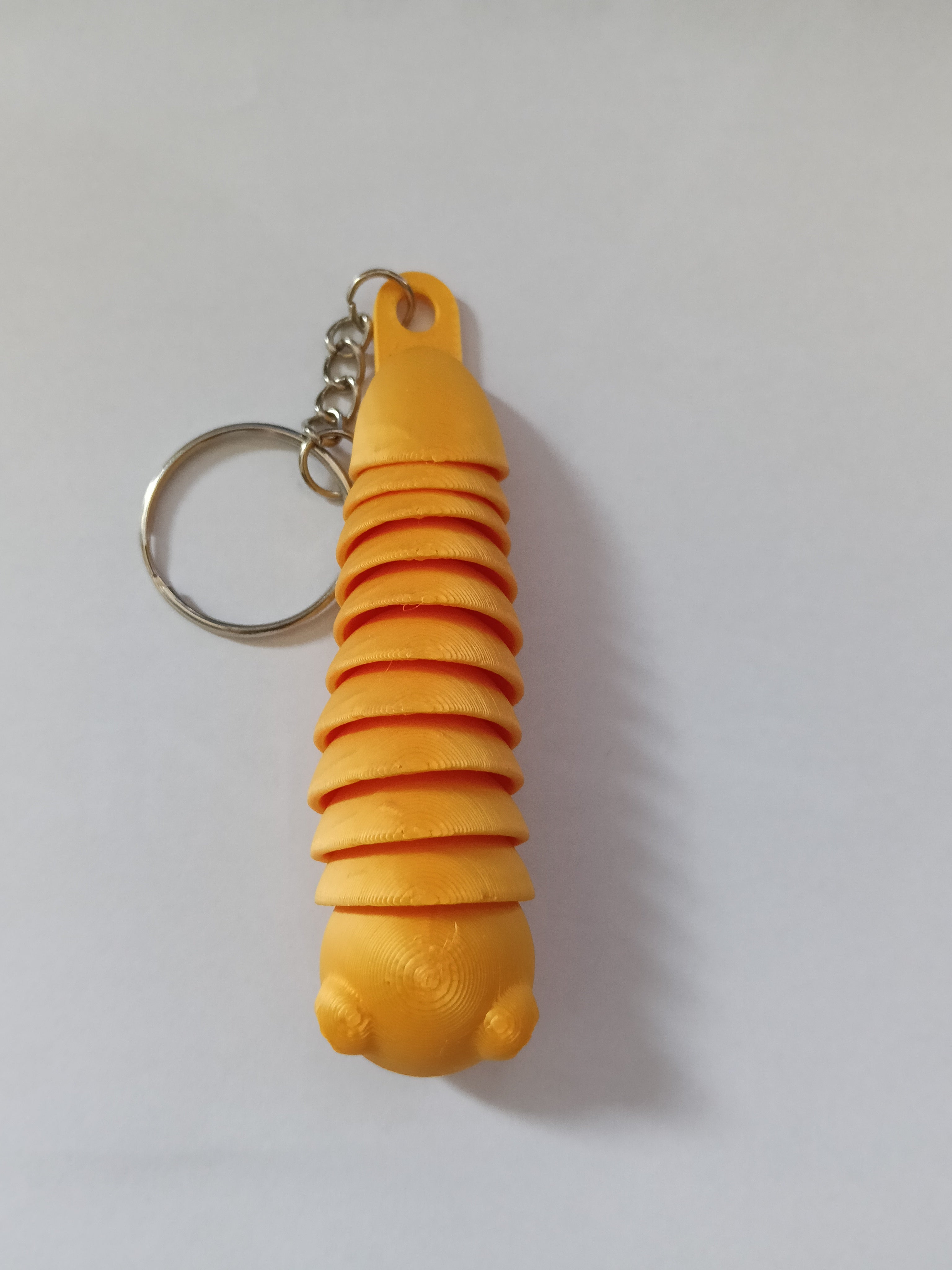 Ruchomy Brelok Robaczek 3D – kolorowy fidget z kolekcji Madi Studio